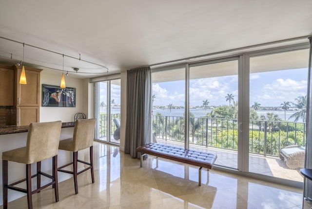 dining area with floor to ceiling windows