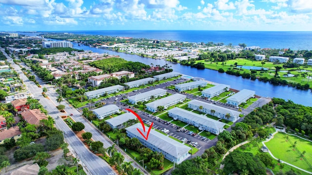 birds eye view of property featuring a water view