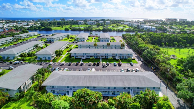 birds eye view of property featuring a water view