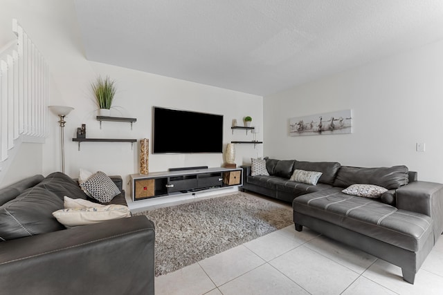 tiled living room with a textured ceiling