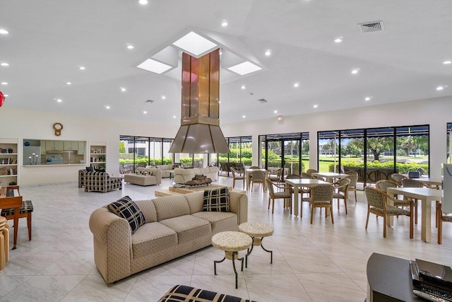 tiled living room with a skylight