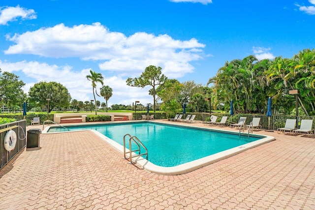 view of swimming pool with a patio area