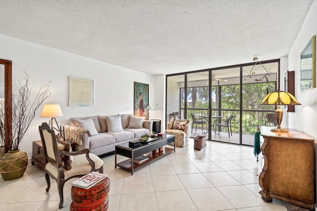 living room with floor to ceiling windows, a textured ceiling, and light tile floors