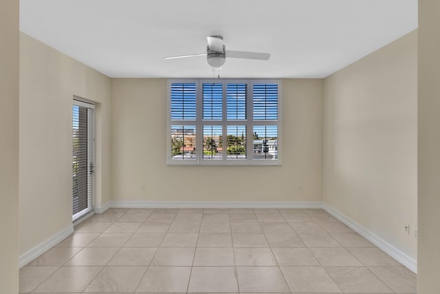 tiled empty room with ceiling fan