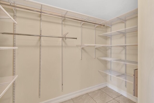 spacious closet featuring tile patterned floors