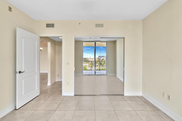 empty room with light tile patterned floors