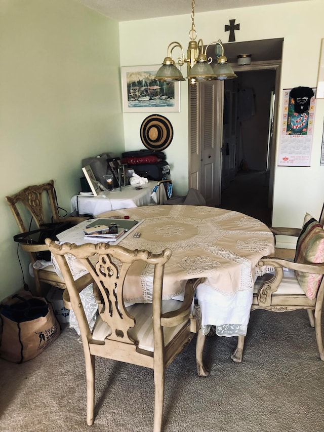 carpeted dining area with a chandelier