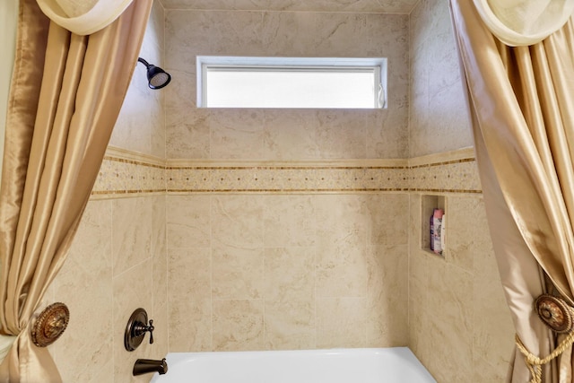 bathroom featuring shower / tub combo and plenty of natural light