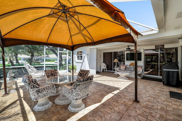 view of patio / terrace featuring ceiling fan and grilling area