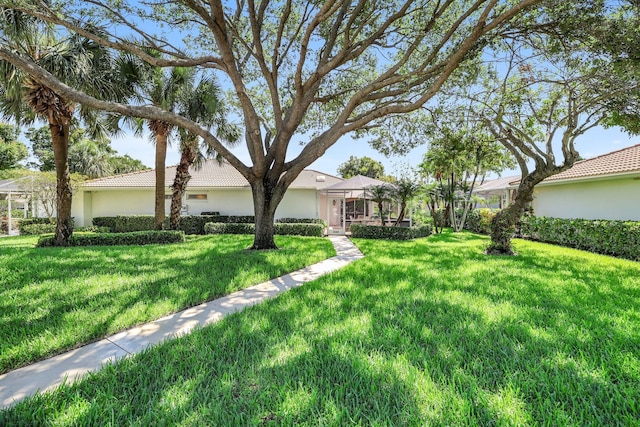 view of front of home with a front lawn