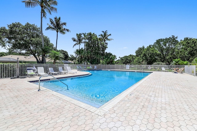 view of swimming pool with a patio area