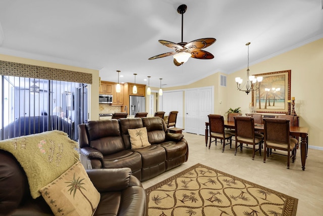 tiled living room with ceiling fan with notable chandelier, vaulted ceiling, and ornamental molding