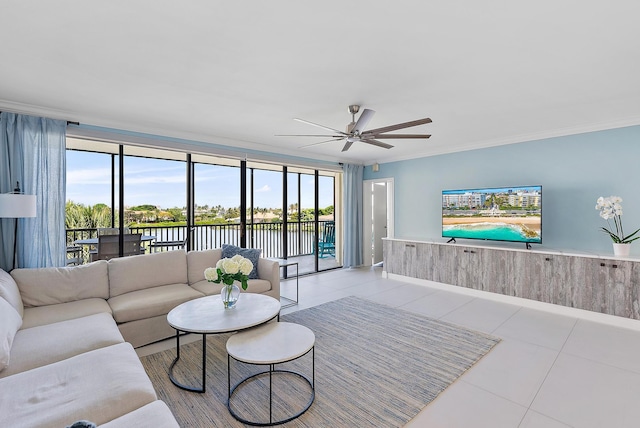 tiled living room featuring ceiling fan, crown molding, and a wealth of natural light