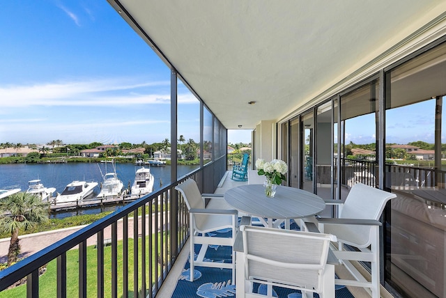 balcony featuring a water view