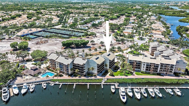 birds eye view of property with a water view