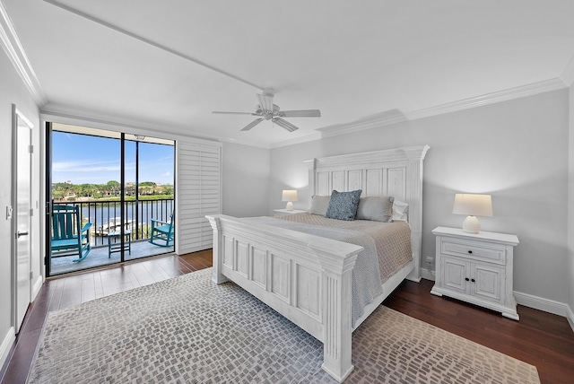 bedroom featuring a water view, access to exterior, ceiling fan, dark hardwood / wood-style floors, and crown molding