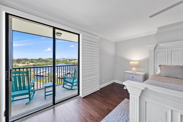 bedroom featuring access to outside, crown molding, dark hardwood / wood-style flooring, and a water view