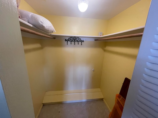 spacious closet featuring tile flooring