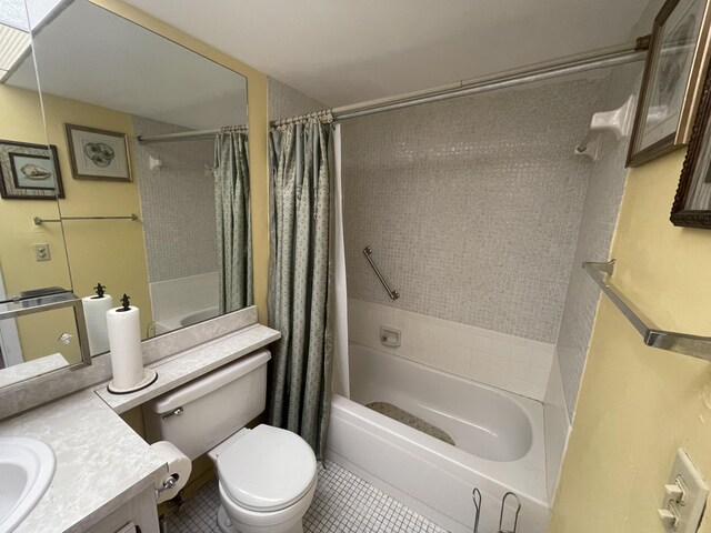 full bathroom featuring vanity, toilet, tile floors, and shower / tub combo