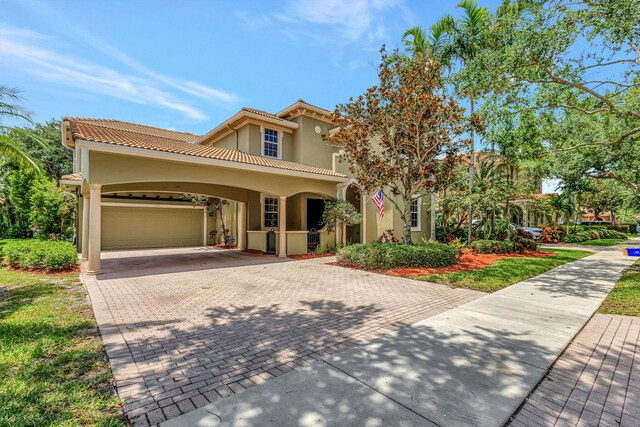 mediterranean / spanish house with a carport