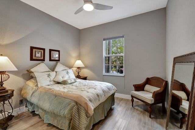 sitting room with ceiling fan, a textured ceiling, and light wood-type flooring