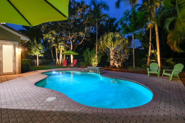 view of swimming pool with a patio and pool water feature