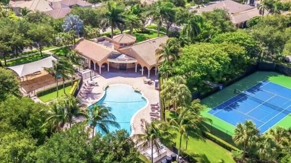 view of swimming pool with a patio and a yard