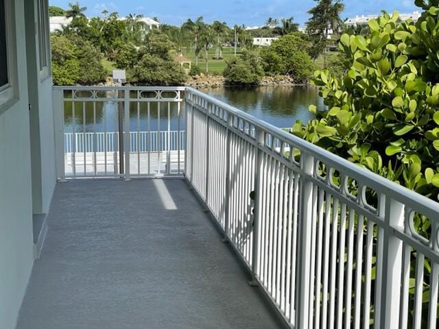 balcony featuring a water view