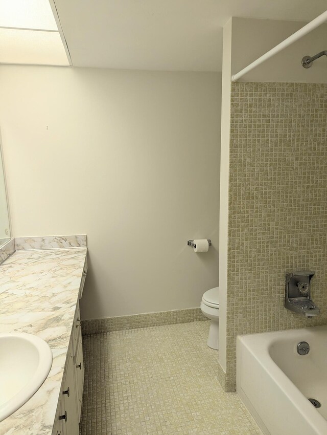 bathroom with walk in shower, vanity, and toilet