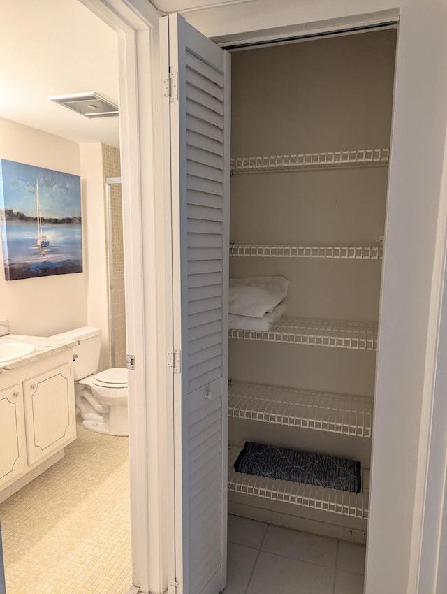 closet with a sink and visible vents