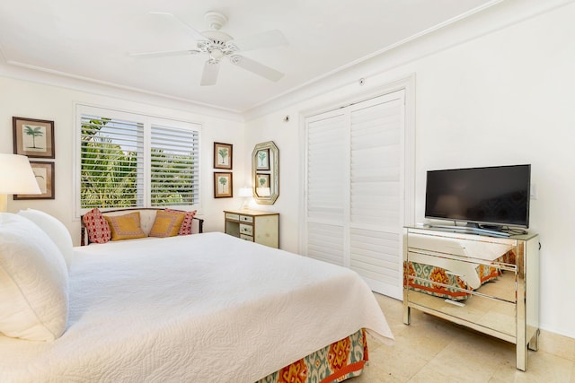 bedroom featuring ceiling fan and crown molding