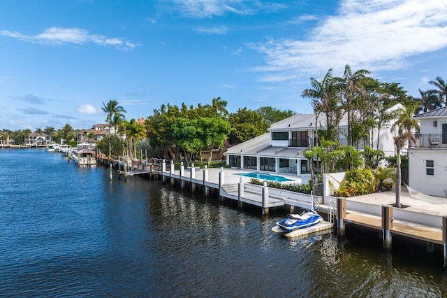 view of dock featuring a balcony, a water view, and a patio