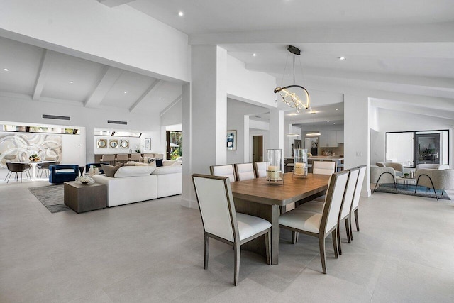 tiled dining area with a notable chandelier, high vaulted ceiling, and beam ceiling