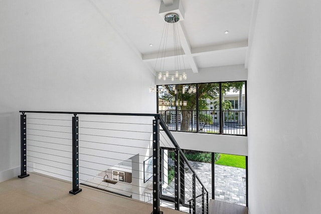 staircase with beam ceiling