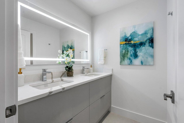 bathroom featuring dual bowl vanity