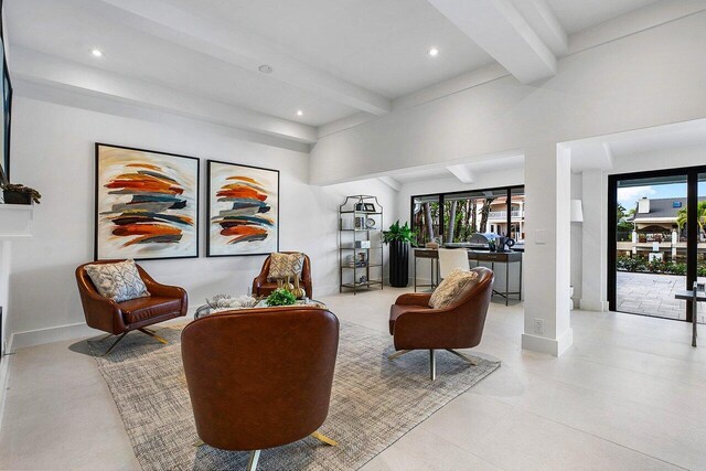 tiled living room featuring beamed ceiling