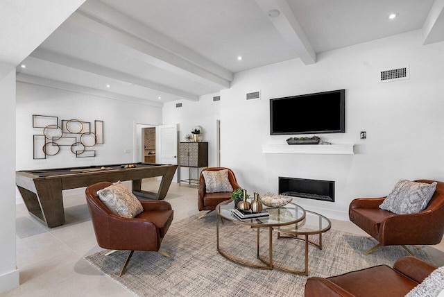 living room with beamed ceiling