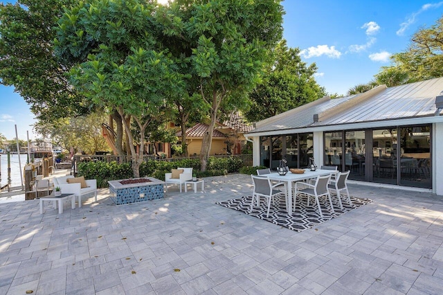 view of patio / terrace with an outdoor fire pit