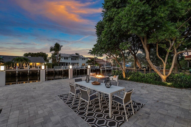 patio terrace at dusk with a water view