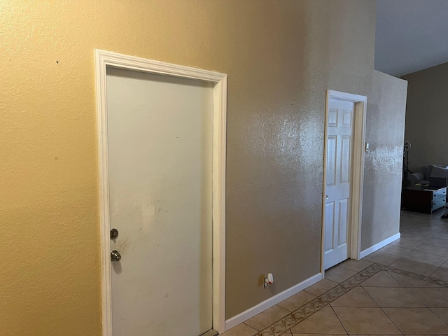 corridor with tile flooring