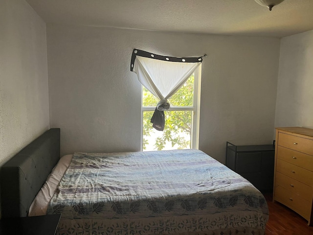 bedroom with wood-type flooring