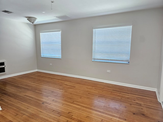 unfurnished room featuring light hardwood / wood-style floors