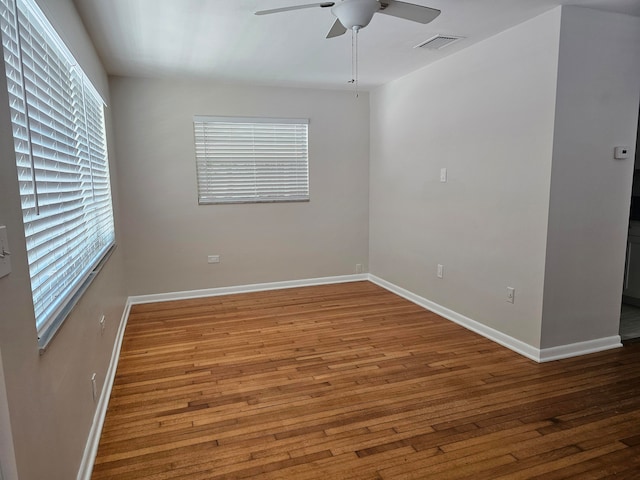 unfurnished room featuring ceiling fan and hardwood / wood-style floors