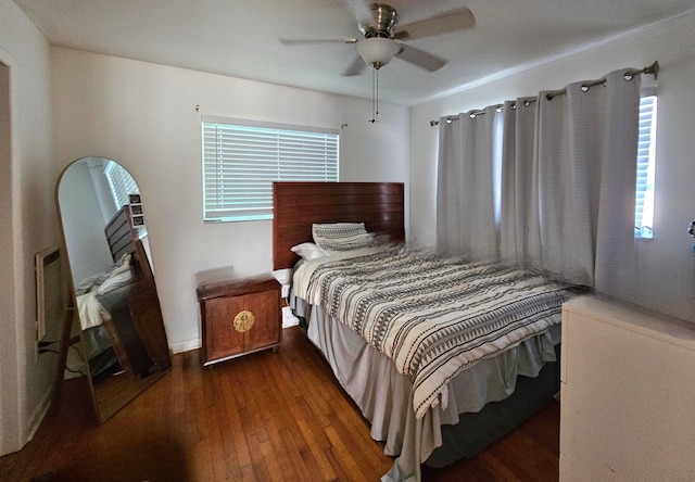 bedroom featuring dark hardwood / wood-style floors and ceiling fan