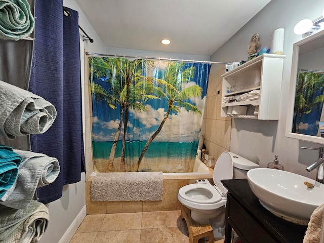 full bathroom with tile walls, shower / bath combination with curtain, tile floors, toilet, and vanity