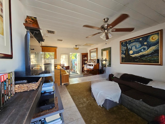 tiled living room with ceiling fan