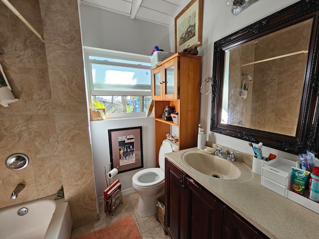 full bathroom with tile flooring, tiled shower / bath, toilet, and vanity with extensive cabinet space