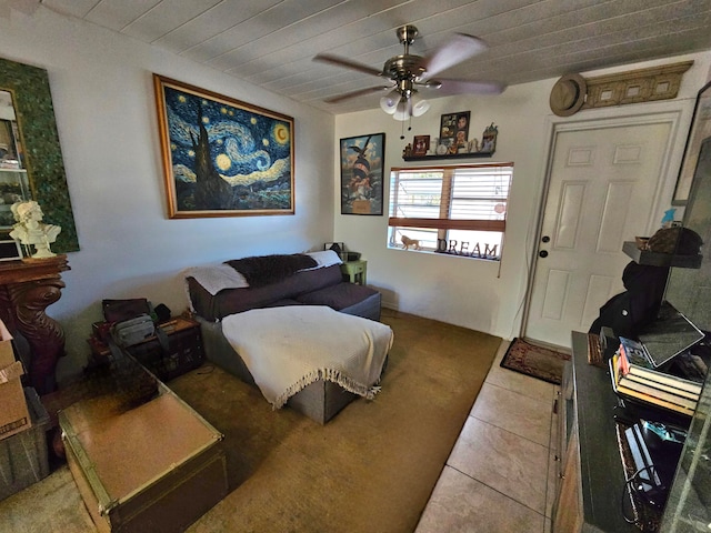 bedroom featuring tile flooring and ceiling fan