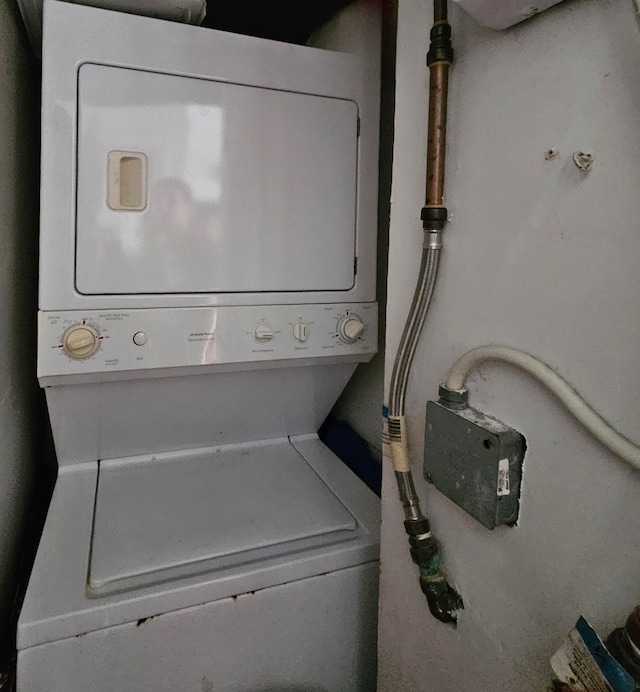 laundry room with stacked washer and clothes dryer