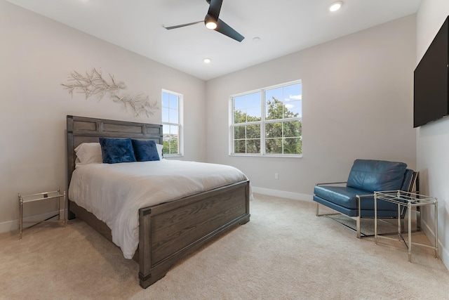 bedroom featuring ceiling fan and light colored carpet